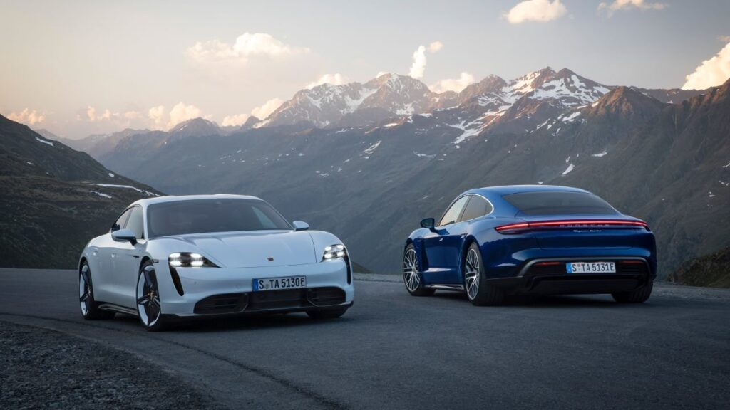 Porsche Says the Taycan Is Staying, Just With a Leaner Lineup Porsche Taycan electric sports car driving on a modern road