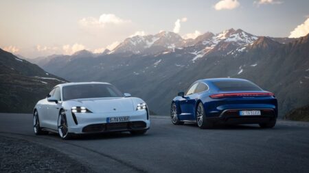 Porsche Says the Taycan Is Staying, Just With a Leaner Lineup Porsche Taycan electric sports car driving on a modern road