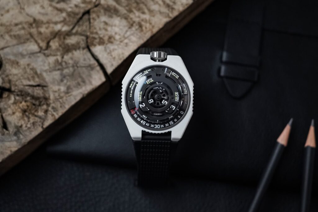 Urwerk UR-100V Lightspeed Ceramic Makes Cosmic Time Wearable Urwerk UR-100V Lightspeed Ceramic watch with white composite case and black satellite-hour dial
