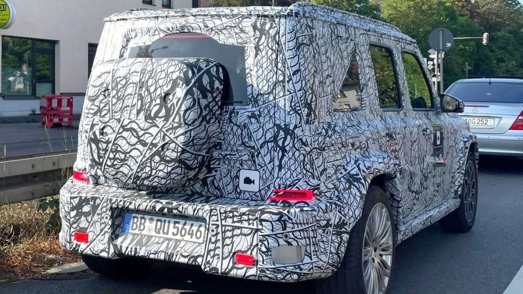 Camouflaged Mercedes baby G-Class prototype testing on a city street in Munich
