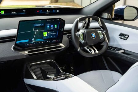 BMW Bets on Touchscreens and Voice Control to Win Younger Drivers BMW Neue Klasse-style interior with a wide digital display and minimal physical controls