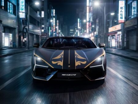 Lamborghini supercar parked at an automotive event with dramatic lighting