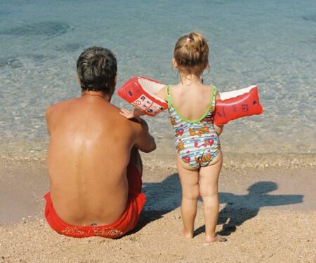 How to Plan a Villa Holiday That Works for Every Generation Multi-generational family relaxing together at a private villa terrace with a pool