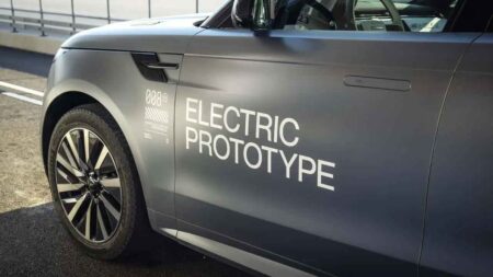 Range Rover Electric Moves Ahead as Defender EV Timeline Slips Range Rover Electric concept-style SUV driving on a modern road at dusk