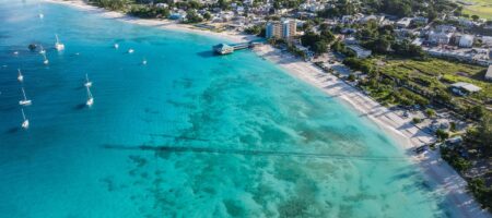 Five Accessible Property Markets Offering Strong Rental Yields Luxury coastal property with pool overlooking a tropical shoreline