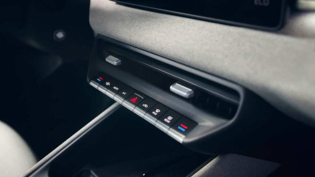 Volkswagen Brings Back Buttons as Touch Controls Lose Momentum Volkswagen electric vehicle interior with physical buttons and modern digital displays