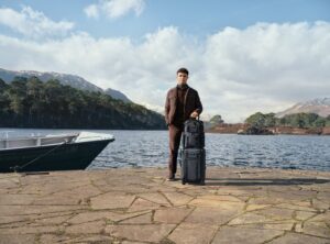 Lando Norris with TUMI luggage in a rugged Scottish highlands setting for Autumn Winter 2026