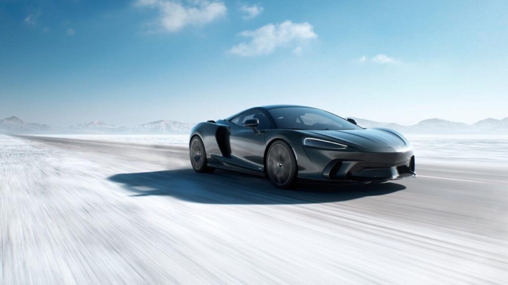 McLaren 750S and GTS supercars on a clean studio-style road backdrop
