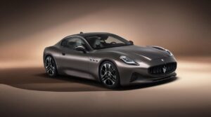Maserati electric SUV and grand tourer concept silhouette in a modern Chinese EV factory