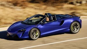 McLaren Artura hybrid supercar on a road at dusk