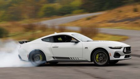 Ford Mustang sales paused in Australia over wiring harness recall Ford Mustang coupe in a dealership setting in Australia