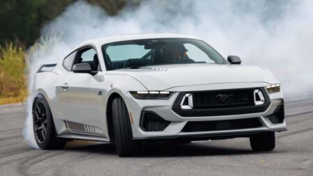 Ford Mustang EcoBoost Gets New September Lease and Cash-Back Offers 2026 Ford Mustang EcoBoost coupe driving on a sunlit road