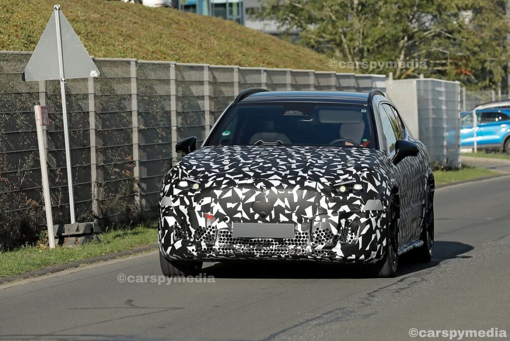 Camouflaged Mercedes-AMG electric SUV prototype testing on the road