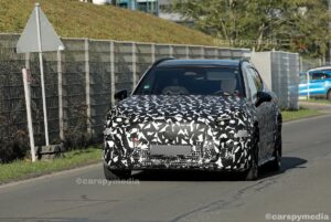 Camouflaged Mercedes-AMG electric SUV prototype testing on the road