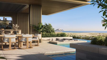Four Seasons Private Residences Abu Dhabi at Saadiyat Beach with curved architecture beside the coastline