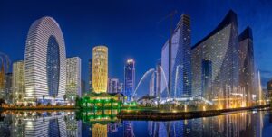 Panoramic view of Georgia with vineyards, mountains and modern real estate development
