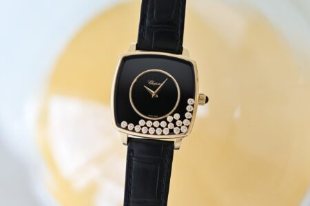 Chopard Revisits Its Free Floating Diamonds for a 1976 Anniversary Piece Chopard Happy Diamonds Heritage watch with yellow gold cushion case and black onyx dial