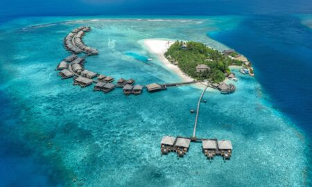 Overwater villas at Adaaran Prestige Vadoo in the Maldives surrounded by turquoise ocean