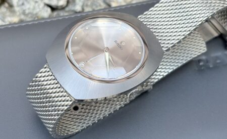 A Week With the Rado DiaStar Original 60th Anniversary Rado DiaStar Original 60th Anniversary on a mesh bracelet showing its faceted sapphire crystal and grey dial