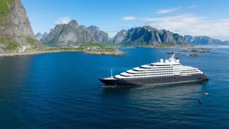The Luxury Superyachts and Cruise Ships Setting the Tone for 2026 Luxury expedition cruise ship sailing through polar waters at sunset