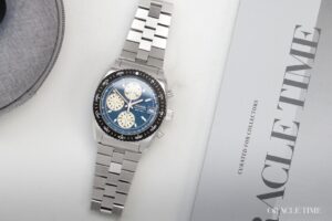 Nivada Grenchen x WatchGecko Autochron Teal watch with teal dial and cream subdials