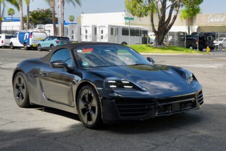 Porsche’s Electric 718 Boxster Moves Into US Testing Porsche 718 Boxster EV prototype testing with light camouflage and black aero wheels
