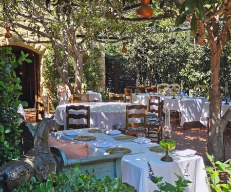Outdoor terrace dining and lush gardens at San Ysidro Ranch in Santa Barbara