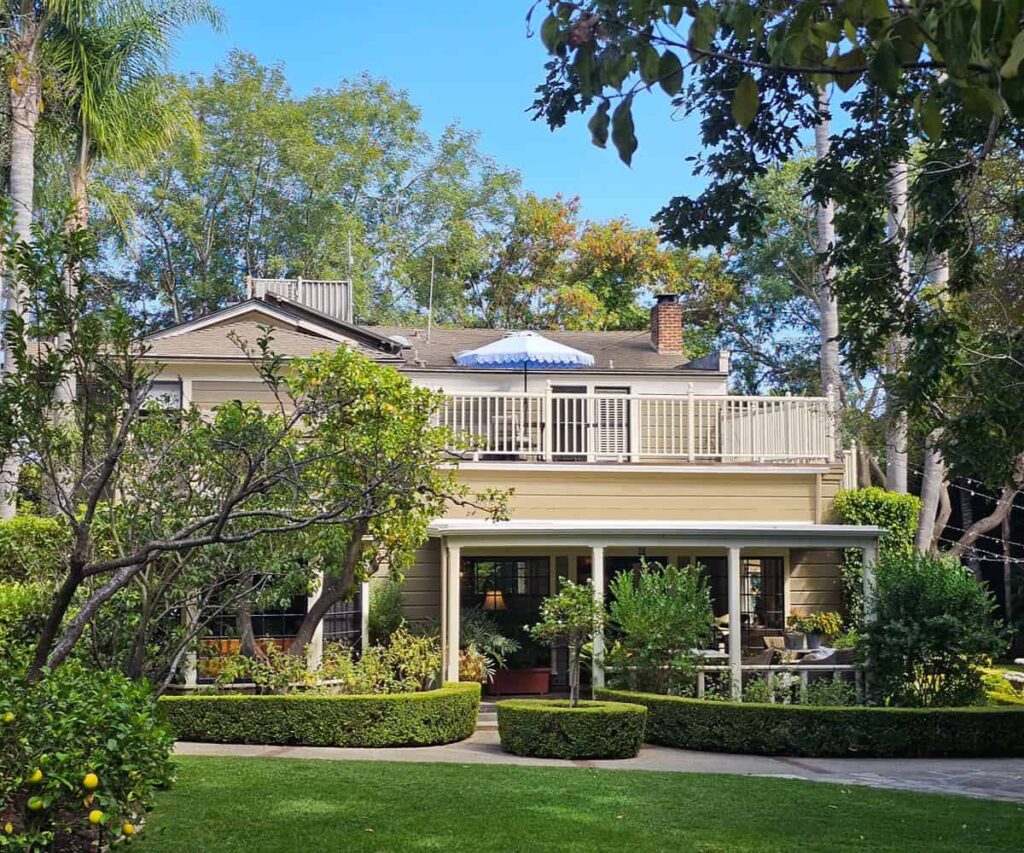 The garden and Victorian exterior of Simpson House Inn in Santa Barbara