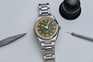Singer Reimagined 1970 DualTrack GMT watch on integrated stainless steel bracelet