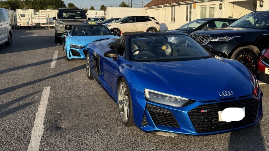 Supercar wedding convoy vehicles including Lamborghini Huracans, Audi R8 Spyders and a Mercedes-AMG G63 after police action in the UK
