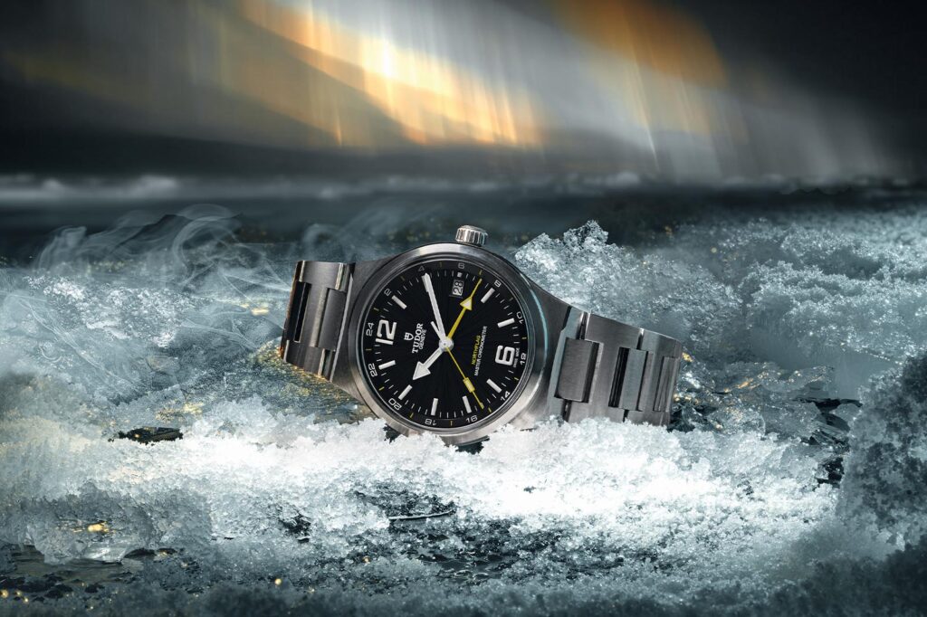 Tudor Brings Back the Northflag as a Master Chronometer GMT Tudor Northflag Master Chronometer GMT with black dial and yellow accents on steel bracelet