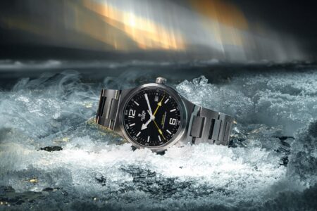 Tudor Northflag Master Chronometer GMT with black dial and yellow accents on steel bracelet