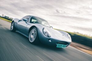 Wells Vertige compact British sports car on a country road