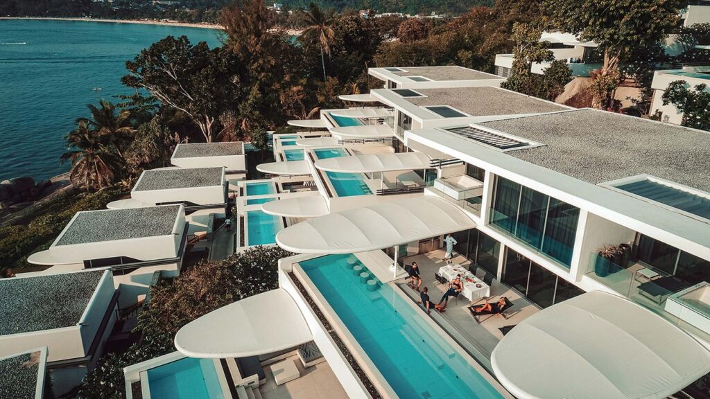 Luxury Travel Contests to Enter for Japan, the Maldives and Safari Escapes Luxury travel mood board with passport, boarding pass, tropical beach, safari landscape and city hotel details