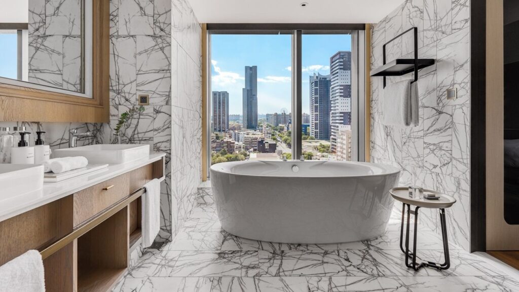 Taiwan’s Best Luxury Hotels for City, Mountain and Lakeside Escapes Luxury hotel room overlooking Taiwan city skyline and mountains