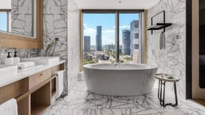 Luxury hotel room overlooking Taiwan city skyline and mountains
