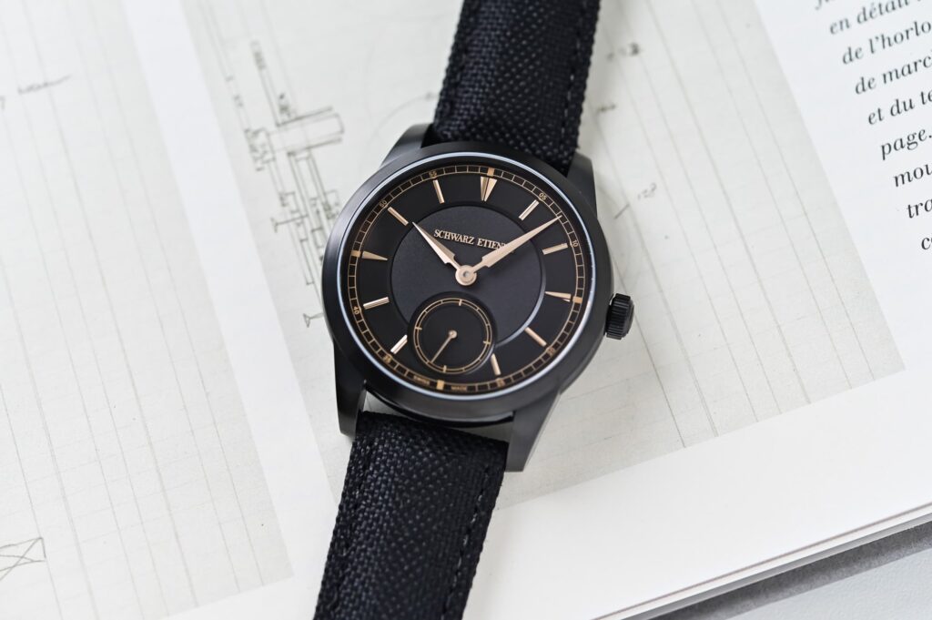 Schwarz Etienne 1902 Petite Seconde Heure Dorée with black DLC titanium case and gold-toned dial accents