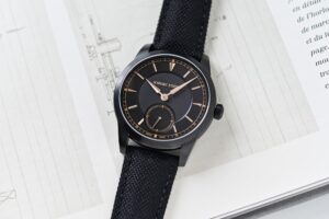 Schwarz Etienne 1902 Petite Seconde Heure Dorée with black DLC titanium case and gold-toned dial accents