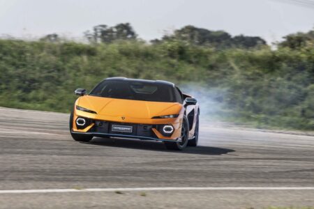 Lamborghini Temerario hybrid supercar driving on a dramatic road