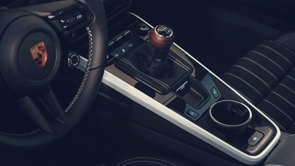 Porsche Patent Hints at a Manual-Style Dual-Clutch Future Porsche sports car gear selector and steering wheel interior