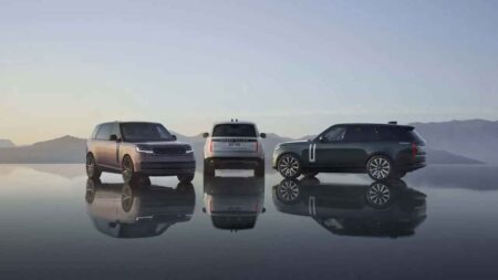 Range Rover Electric Opens US Orders With 627 LB-FT of Torque Range Rover Electric luxury SUV driving on a quiet mountain road