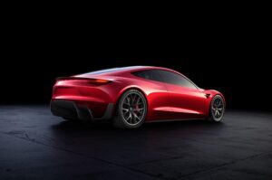 Tesla Roadster front end teaser showing a full-width LED light bar in darkness