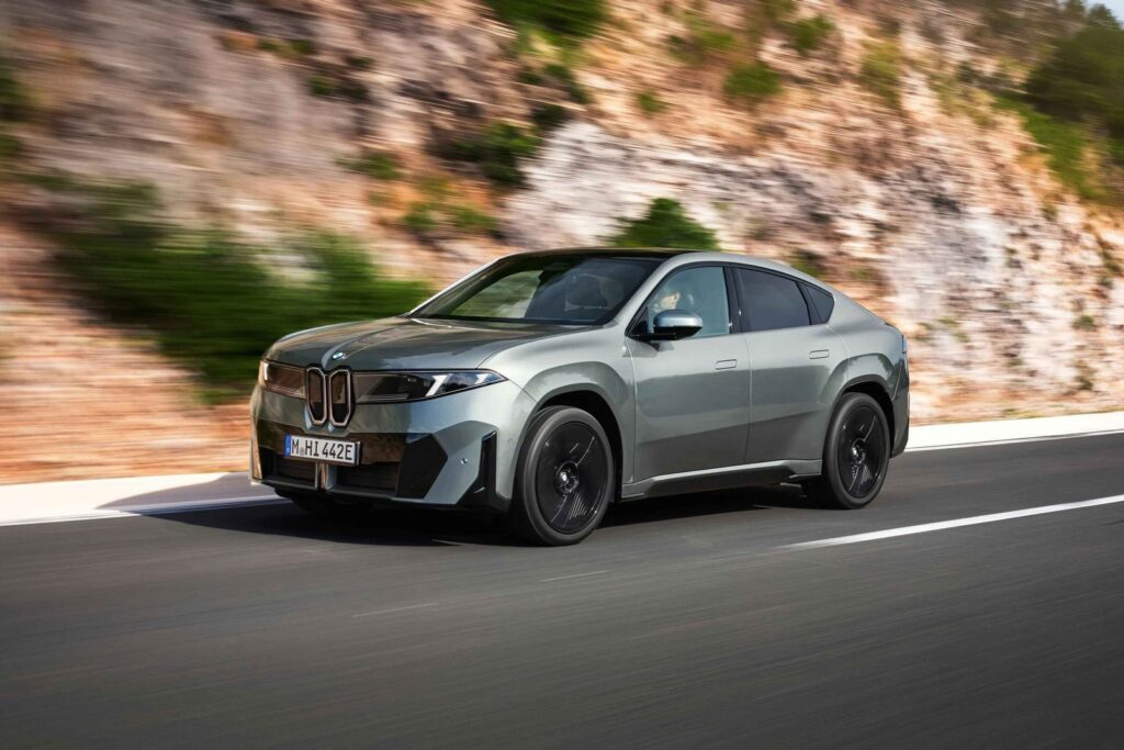 BMW iX4 Set for Australia With Dual-Motor Power and a $103,900 Entry Price BMW iX4 electric coupe SUV driving on a modern Australian road