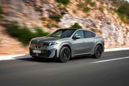 BMW iX4 Set for Australia With Dual-Motor Power and a $103,900 Entry Price BMW iX4 electric coupe SUV driving on a modern Australian road