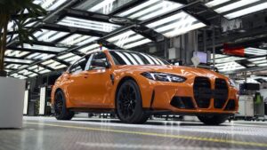 BMW vehicles in a modern production facility representing shared component strategy