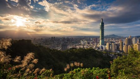 Taipei skyline with Taipei 101 rising above the city at dusk