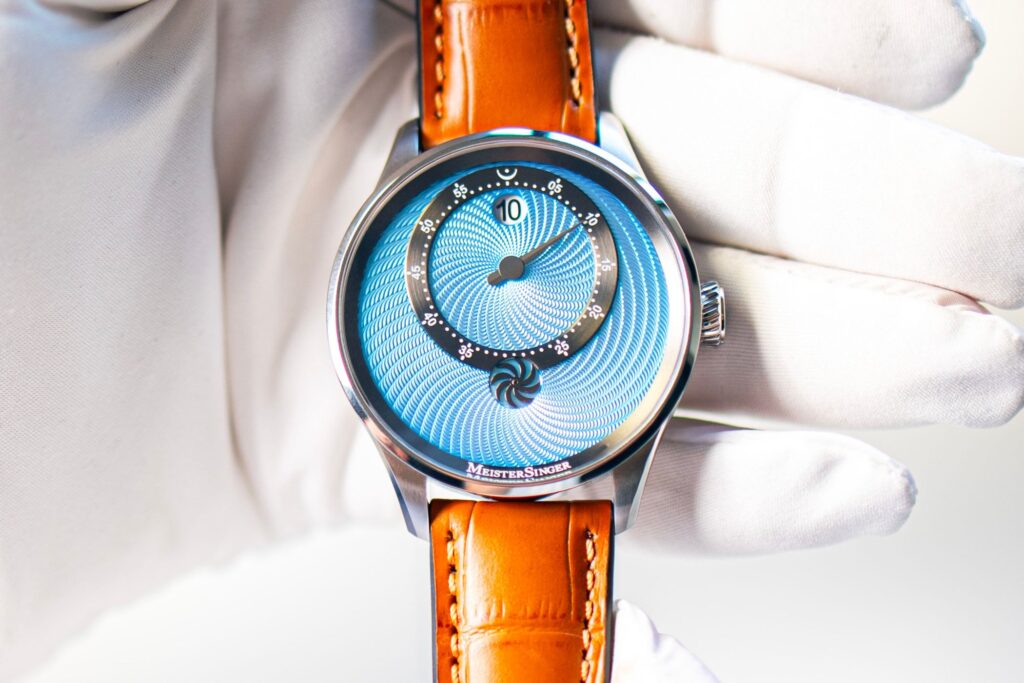 MeisterSinger Gives the Panthero Jumping Hour a Light Blue Guilloché Dial MeisterSinger Panthero Jumping Hour with light blue guilloché dial on cognac leather strap