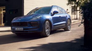 Porsche Macan driving on a mountain road