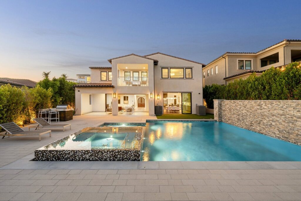 How to Position a Luxury Home for a Stronger Sale Price Elegant luxury home exterior with landscaped grounds prepared for sale