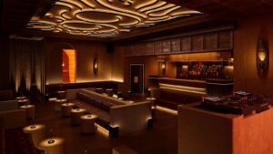 Atmospheric dark London nightclub interior with warm lighting and intimate seating
